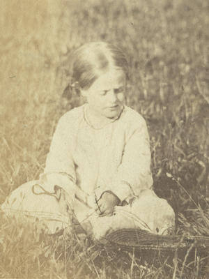 Girl seated in a field